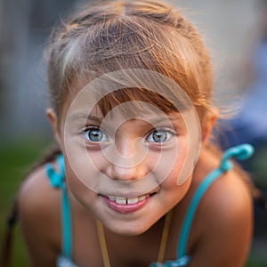 Closeup portrait of a playful cute little girl. Happy.