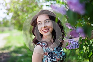 Closeup portrait of positive brunette girl Beauty smiling model with natural make up and long eyelashes. Youth and skin care conce