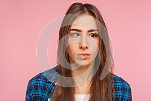 Closeup portrait of positive brunette girl looking with one crossed eye, making silly awkward face