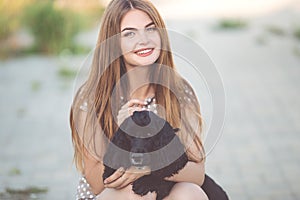 Closeup portrait of pretty young teen girl with black cocker spaniel dog