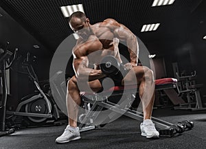 Closeup portrait of professional bodybuilder workout with barbel
