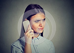Closeup portrait, sad, unhappy woman talking on phone