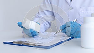 Closeup portrait, Scientists in white lab coats are analyzing the vital substance of the sample drug in a lab