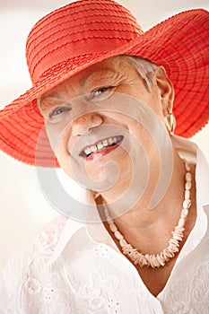 Closeup portrait of senior woman wearing hat