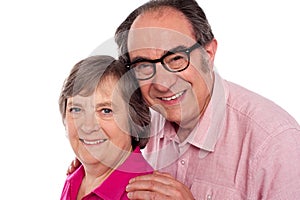 Closeup portrait of smiling aged couple