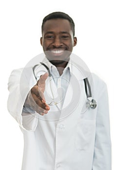 Closeup portrait smiling black healthcare professional doctor with stethoscope, giving handshake.