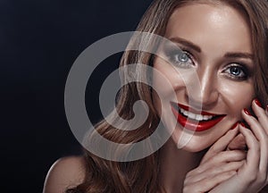 Closeup portrait of smiling caucasian young woman model with glamour red lips, bright makeup.