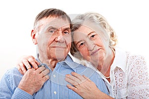 Closeup portrait of smiling elderly couple