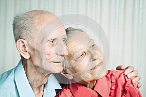 Closeup portrait of smiling elderly couple