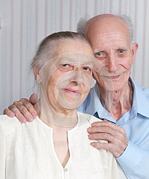 Closeup portrait of smiling elderly couple