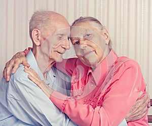 Closeup portrait of smiling elderly couple