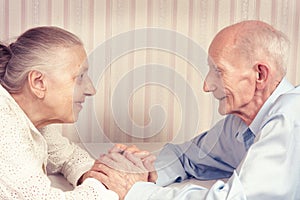 Closeup portrait of smiling elderly couple