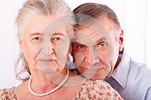 Closeup portrait of smiling elderly couple