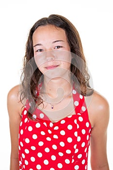 Closeup portrait of smiling teen girl wearing red white fifties dress over white background