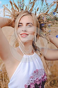 Closeup portrait of smiling young blond lady with