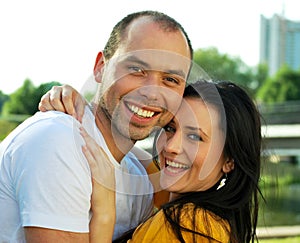 Closeup portrait of smiling young couple