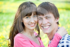 Closeup portrait of smiling young couple