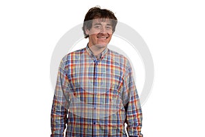 Closeup portrait of smiling young man in checkered shirt.