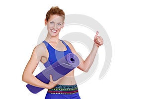 Closeup portrait of a sportive woman showing thumbs up