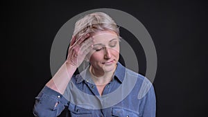 Closeup portrait of startled adult woman looking at camera being upset and nervous