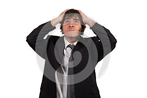 Closeup portrait, stressed young business man, hands on head with bad headache, isolated background.
