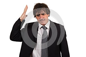 Closeup portrait, stressed young business man, hands on head with bad headache, isolated background.