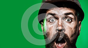 Closeup portrait surprised construction worker in hard hat. Amazed bearded industrial worker in protective helmet. Male