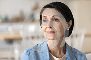 Closeup portrait thoughtful middle-aged woman staring aside