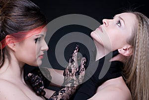 Closeup portrait of two girls: good & evil