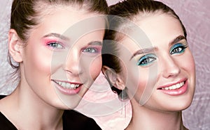 Closeup portrait of two young pretty women. Bright professional makeup