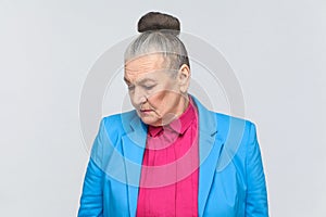 Closeup portrait of unhappy aged woman.