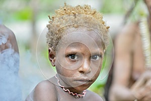 Closeup Portrait of unidentified Papuan little boy of Korowai tribe