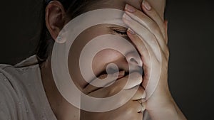 Closeup portrait of upset frustrated woman crying alone at night