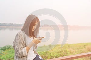 Closeup portrait upset sad skeptical unhappy serious woman talking texting on phone.