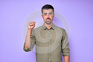 closeup portrait view of man showing yes sign in deaf language