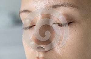 Closeup portrait of white woman eyes closed