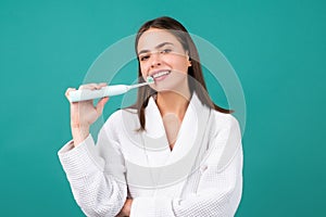 Closeup portrait of womans toothy smile against a isolated background with copy space. Girl brushing her teeth. Dental