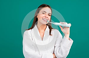 Closeup portrait of womans toothy smile against a isolated background with copy space. Girl brushing her teeth. Dental