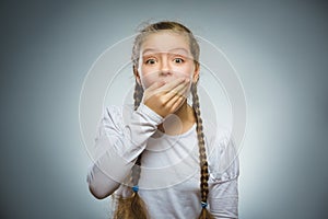 Closeup Portrait of wondering girl going surprise on gray background