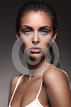 Closeup portrait of young adult woman with clean fresh skin