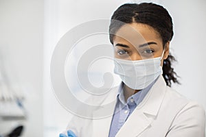Closeup Portrait Of Young African American Female Doctor In Medical Face Mask