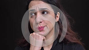 Closeup portrait of young attractive caucasian female getting upset and sad in front of the camera