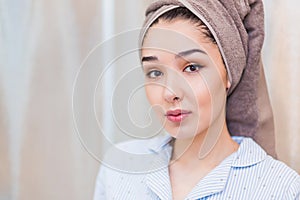 Closeup portrait of young beautiful woman after bath