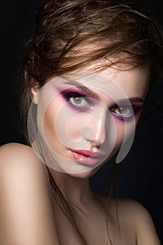 Closeup portrait of young beautiful woman with bright pink smoke