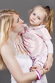 Closeup Portrait of Young Caucasian Female with Little Daughter