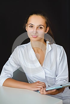 Closeup portrait of young female medical worker in office