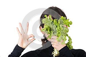 Closeup portrait young girl holding fresh lettuce