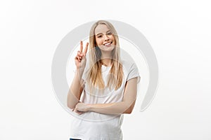 Closeup portrait young happy confident woman giving peace victory, two sign gesture, isolated white studio background