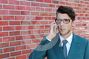 Closeup portrait, young man annoyed, frustrated, off by someone listening on his mobile phone, bad news, outdoors