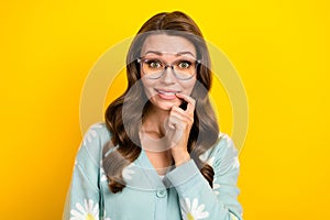 Closeup portrait of young nervous funny lady bite nail confused staring oops stupor panic wear eyeglasses isolated on